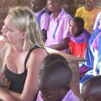 woman sitting with young children