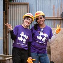 Volunteers wearing purple shirts in Nepal