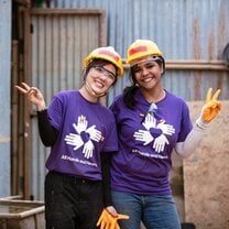 Volunteers wearing purple shirts in Nepal