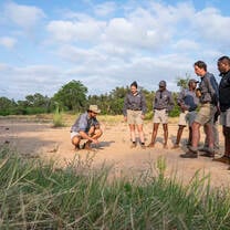 group listening to a speaker in the desert