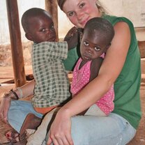 A volunteer doing child care at a home.