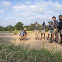 group listening to a speaker in the desert
