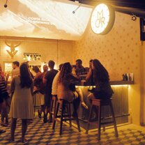 bar tables and people talking
