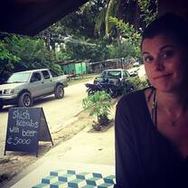 woman at bar outdoor seating