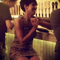 woman at bar holding drink