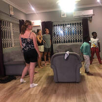 Volunteers entertaining themselves with host family