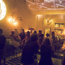 bar tables and people talking 