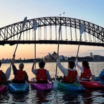 EF Gap Year students kayaking under the Sydney Harbor Bridge