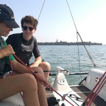 two people on a sail boat in Venice
