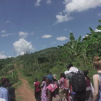 Trekking to home after long day of maize planting