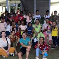 group of volunteers with students 