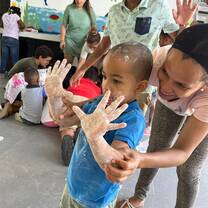 Assist enhance early childhood education in disadvantaged communities