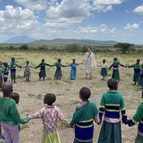 volunteer teachers playing with the students after a break from teaching 