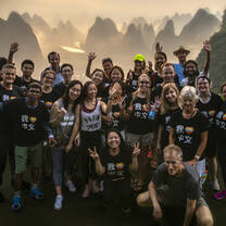 Students stand infront of the Karst landscape of Yangshuo