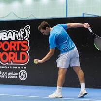 boy playing tennis
