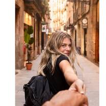 Woman leading a man through the streets of Madrid