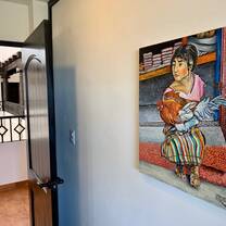 Colorful painting of woman on white wall