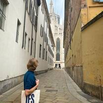 A student poses with their IES Abroad Milano tote bag