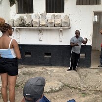 girl listening to speaker at Fort Prizeinstein