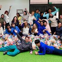 large group of people smiling and posing