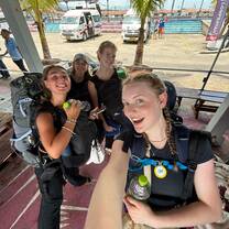 a group poses with a selfie 