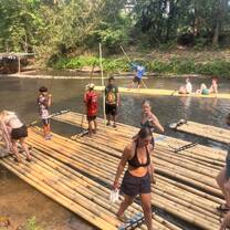 a group balances on boards in the water 