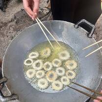 chopsticks over a wok 