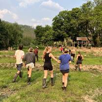 a group is volunteering in a field 