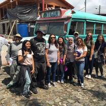 group with blue bus