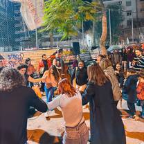 CYA students dancing to live music in the street