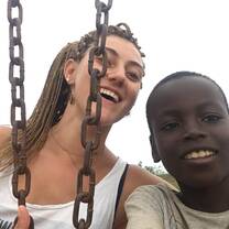 GXVO volunteer playing with a child