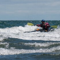 A person kayaking in the Patagonian sea