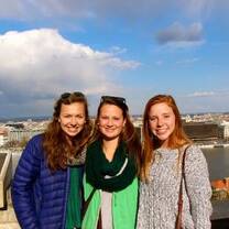 Students standing in front of the Seville skyline