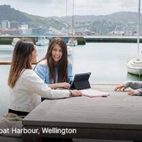 Students enjoying a meal by the harbour