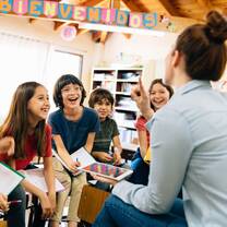 Happy teacher and students.