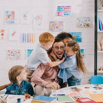 Happy teacher and students.