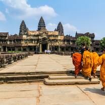 Monks walking towards Angkor Wat temple