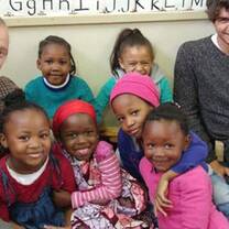 Happy volunteers with children 