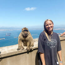 Woman posing with monkey of Gibraltar