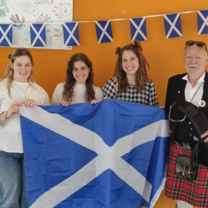 Students holding Scotland flag 