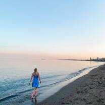 Woman walking by the beach