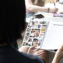 Woman looking at photo book first impressions