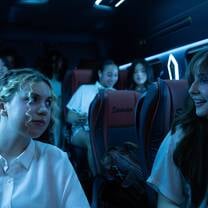 Women talking at bus