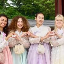 Women wearing hanbok at a palace