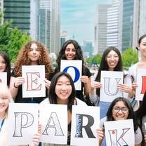 Women holding Seoul Sparks sign