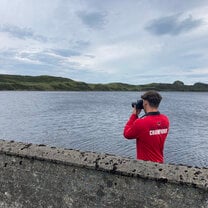 Elliott on a coastal photo-shoot as part of his Internship.