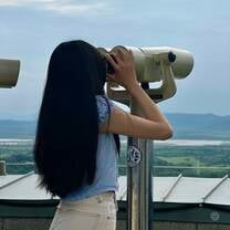 Woman looking with binoculars