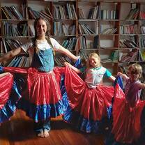 Intern learning traditional dances with the students