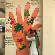 Student with hand on wall