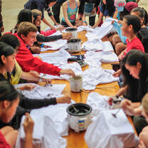 Students are enjoying a traditional local meal